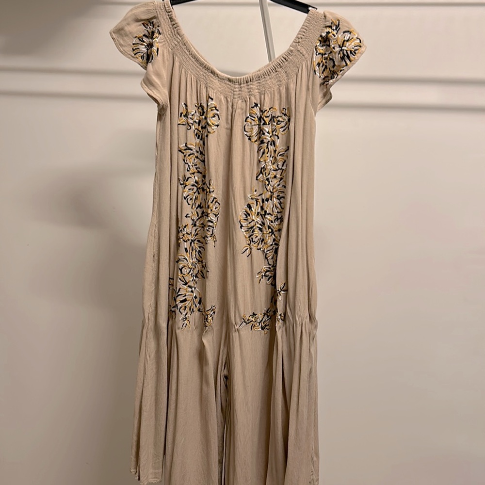 Free People romper. Embroidered detail. XS